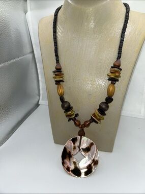 Wooden necklace iridescent shell pendant earthy tones boho tribal inspired bold